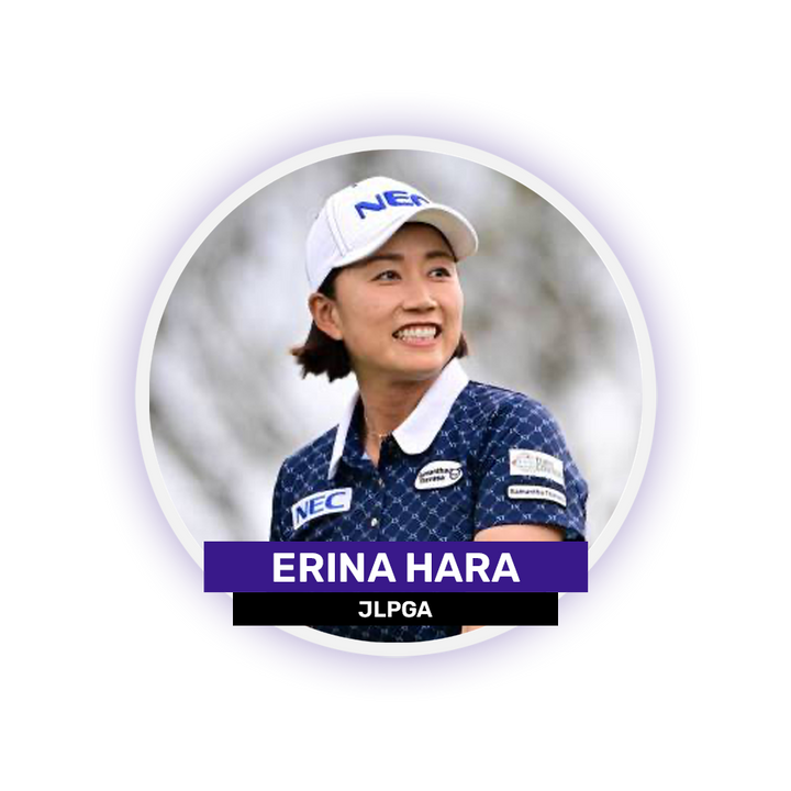 A person wearing a NEC cap and blue patterned shirt with visible sponsor logos, smiling.