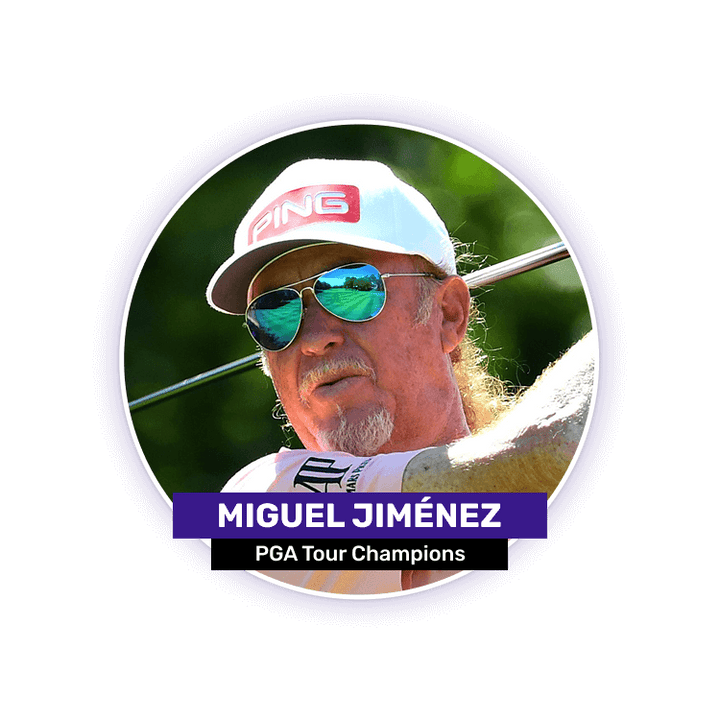 A man wearing sunglasses and a cap swings a golf club.