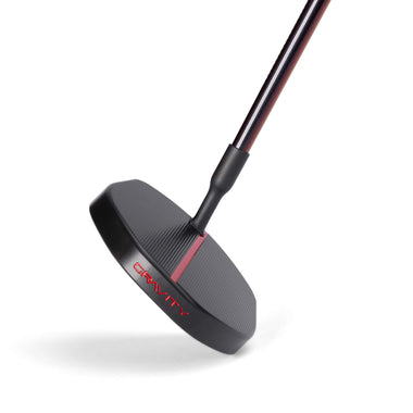 A close-up view of a black and red golf putter head with the word "GRAVITY" on the side.
