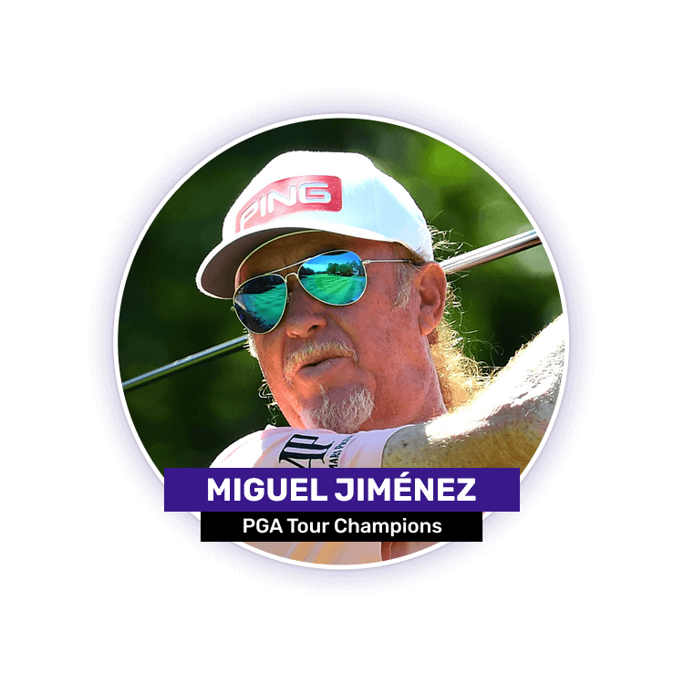 A man wearing sunglasses and a cap swings a golf club.